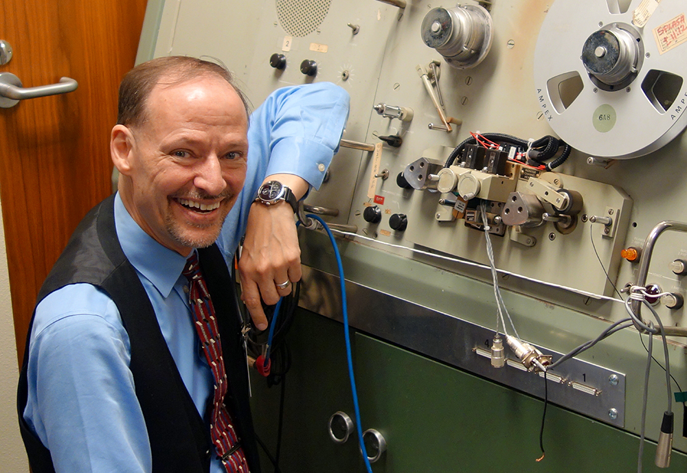 Dr. John H.L. Hansen poses with the SoundScriber device