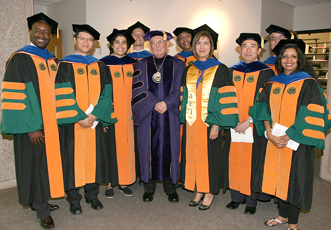 Doctoral Hooding with Dr. Brian Berry center