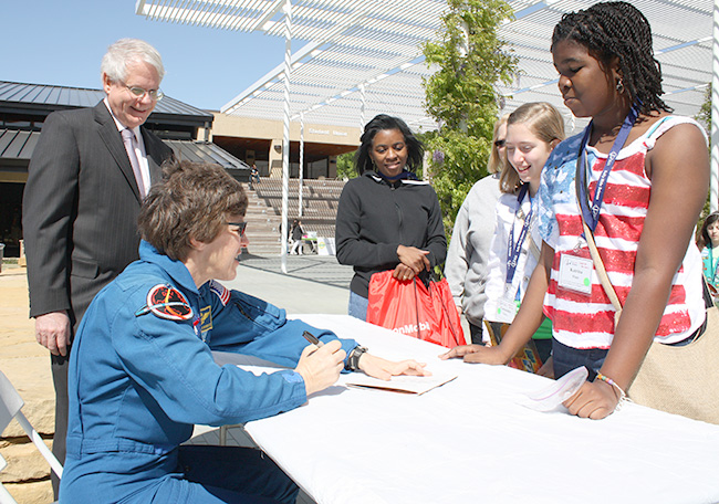 NASA Astronaut Wendy Lawrence signing autographs.