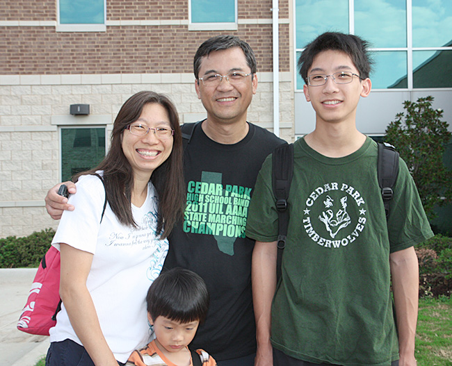 Raymond Lo with his parents and little brother.